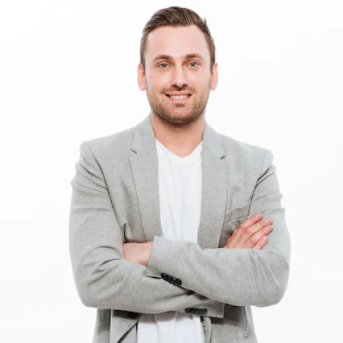 portrait-successful-man-having-stubble-posing-with-broad-smile-keeping-arms-folded_171337-1267